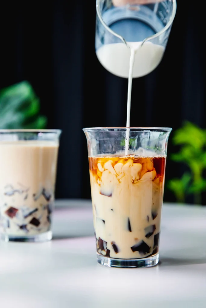 Pour in milk to coffee milk tea|ohsweetcups.com
